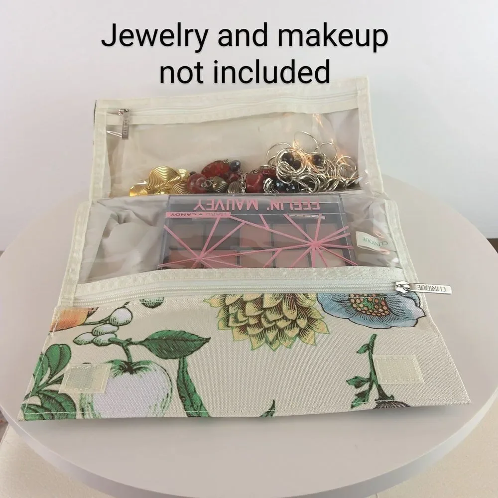 Clinique cream floral print fold over makeup / jewelry bag.